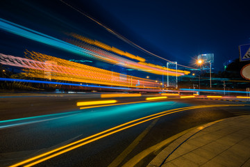 Vehicle light trails in city at night.