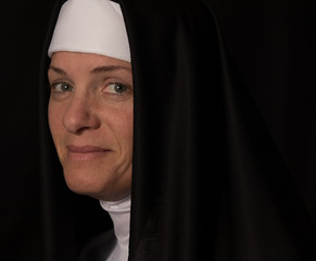 nun is happy and smiles for you