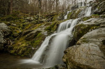 Fototapeta na wymiar large multi step waterfall in rainy weather