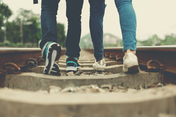 Lovers walk together on railway,loving couple walking outdoor,Walking forward to destination,concept of soulmate,lover and a life partner