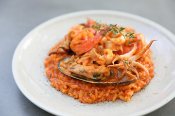 seafood risotto with mussel shrimp and squid , italian food
