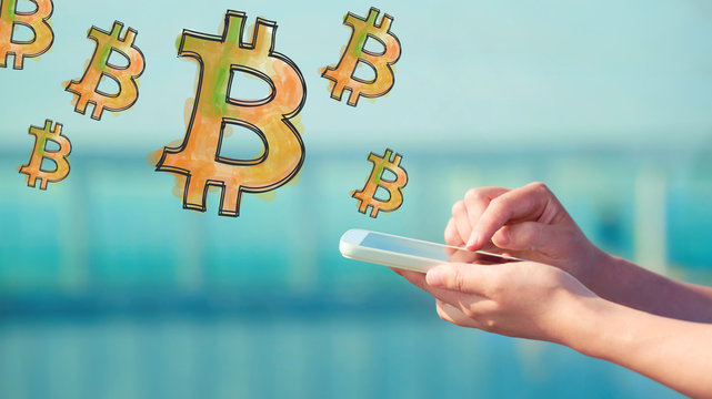 Bitcoin illustration with person holding a smartphone