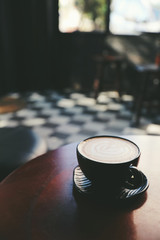 Fototapeta na wymiar Cappuccino coffee break on wood background
