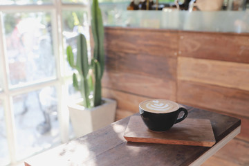 Cappuccino coffee break on wood background