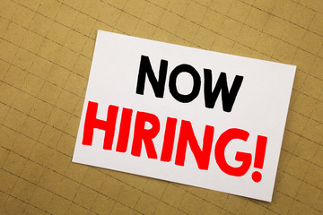 Obraz premium Conceptual hand writing text caption inspiration showing Now Hiring. Business concept for Hire Recruitment Written on sticky note yellow background.