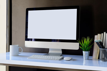 Stylish workspace mockup blank screen desktop computer, coffee mug on white wood.