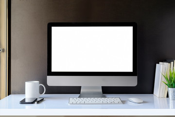 Blank computer desktop with keyboard, coffee mug and other accessories
