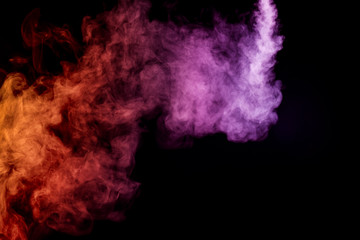 Obraz na płótnie Canvas Cloud of smoke of purple, red and orange colors on black isolated background. Background from the smoke of vape