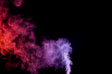 Colorful  pink and red  smoke clouds on dark background.Background of smoke vape