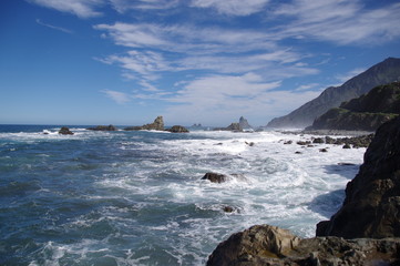 Fototapeta na wymiar Surf and large waves. Spray. Stones