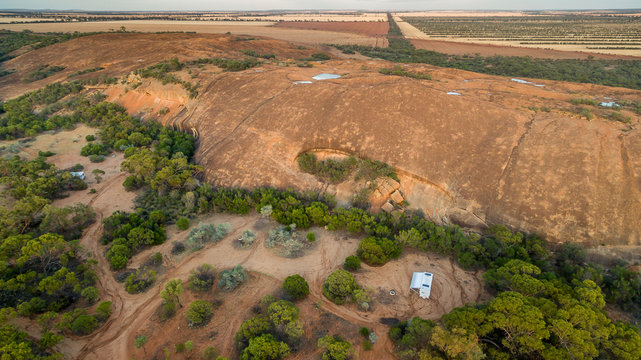Aerial view of caravan and four wheel drive vehicle camped in the outback.