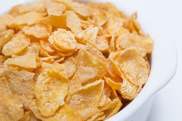  image  Close up Cornflakes cereal breakfast in white bowl on white background.
