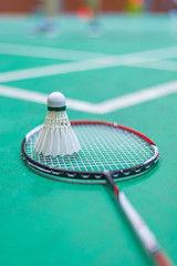 shuttlecock and badminton racket in  court