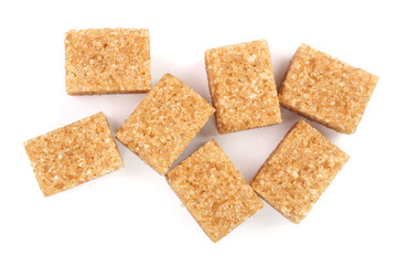 brown sugar cubes isolated on white background. Top view. Flat lay