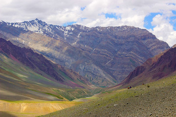 Extreme long shot of trekkers resting at the mountains