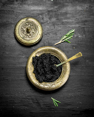 Black caviar in a bowl.