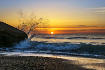 Splashing Wave at Sunset