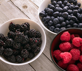 Bowls of fresh fruit; blueberry, raspberry, blackberry 