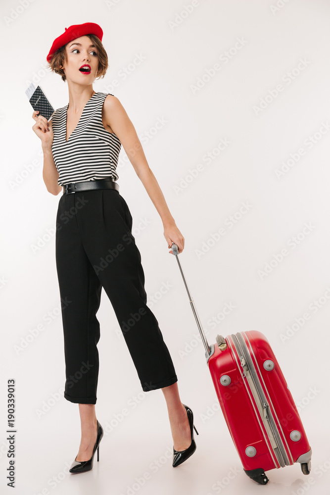 Wall mural Full length portrait of a pretty woman wearing red beret