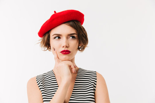 Portrait of a pensive woman dressed in red beret