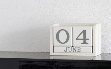 White block calendar present date 4 and month June