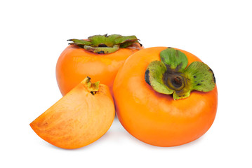 whole and slices of fresh ripe persimmons isolated on white background