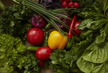 Different raw vegetables on craft paper background. Healthy nutrition.