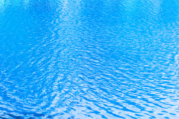 Fototapeta na wymiar blue ripples on the surface of water in lake