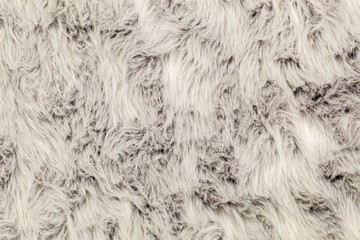 Surface of faux rug