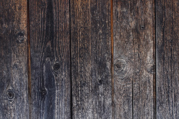 beautiful decorative background with texture of old tarred dark horizontal wooden boards