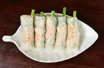 Fresh vietnamese style spring rolls on the dish 