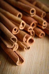 shelves of cinnamon in dark colors on a wooden background