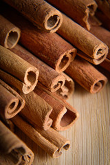 shelves of cinnamon in dark colors on a wooden background