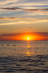 Fototapeta premium Amazing sea sunset, the sun, waves, clouds