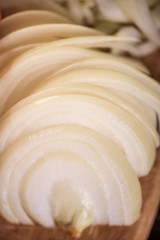 Fototapeta na wymiar sliced raw onion half rings 