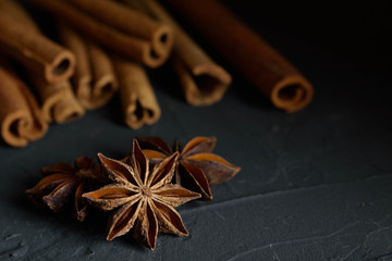  shelves of cinnamon in dark colors on a dark concrete stone background