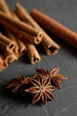  shelves of cinnamon in dark colors on a dark concrete stone background