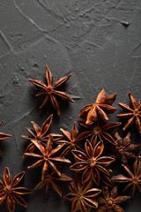  shelves of cinnamon in dark colors on a dark concrete stone background