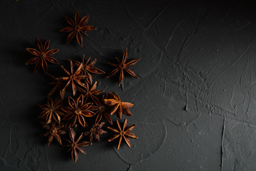  shelves of cinnamon in dark colors on a dark concrete stone background