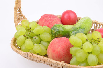 Fruit in the basket isolated on a white background