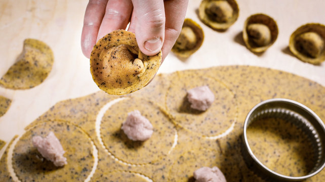 Cappelli del Prete. Typical Emilia Romagna handmade fresh stuffed pasta at the end of preparation process