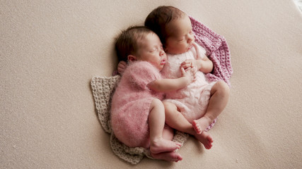 two twins newborn sleeping