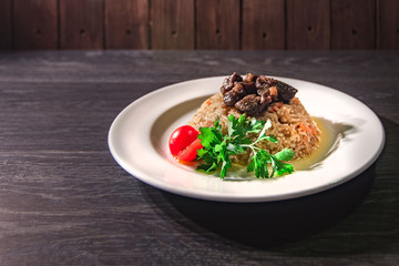 Delicious hot pilaf with meat, rice on oriental