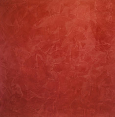 Фактура красная мазков в сумрачном освещении. Венецианская штукатурка, декоративное покрытие для стен