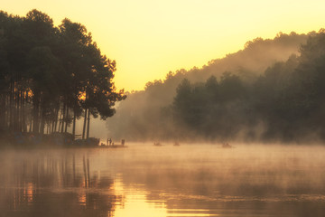 Obraz na płótnie Canvas The lake with fog. Morning light at the lake at Pang Tong Under Royal Forest Park 2 (Pang Ung) National park in Mok Champae,Mae Hong Son District, Thailand