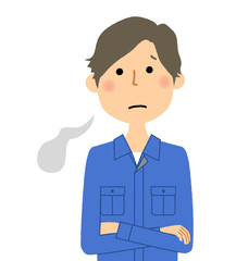作業服の男性　ため息