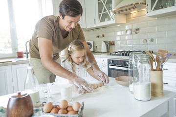 The family cooks in the kitchen 