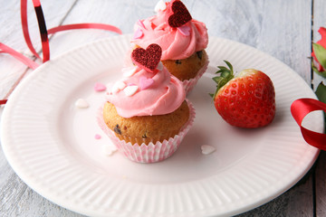 Delicious cupcake for Valentine Day. cake for Valentines day with chocolate and strawberries. Traditional homemade with red roses