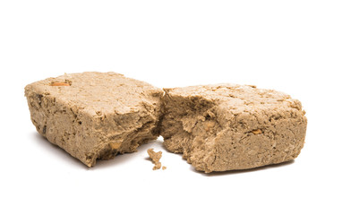 Piece of peanut halva isolated