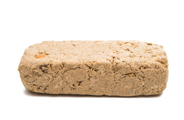 Piece of peanut halva isolated